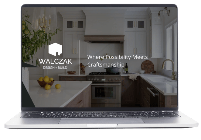 laptop with Walczak Design and Build logo, photo of a kitchen in background and words Where Possibility Meets Craftsmanship