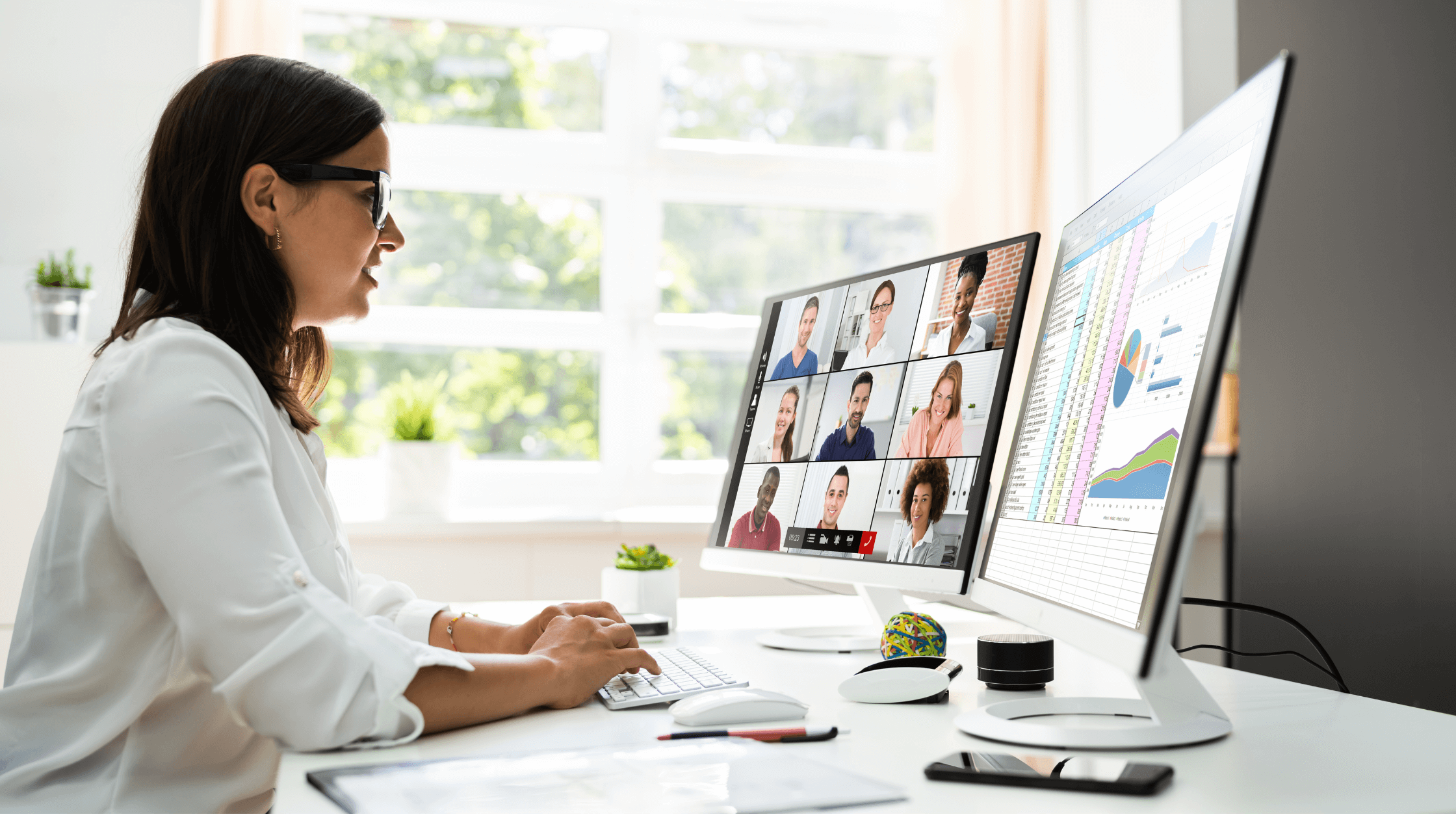 person in front of a computer. other people on a video call.