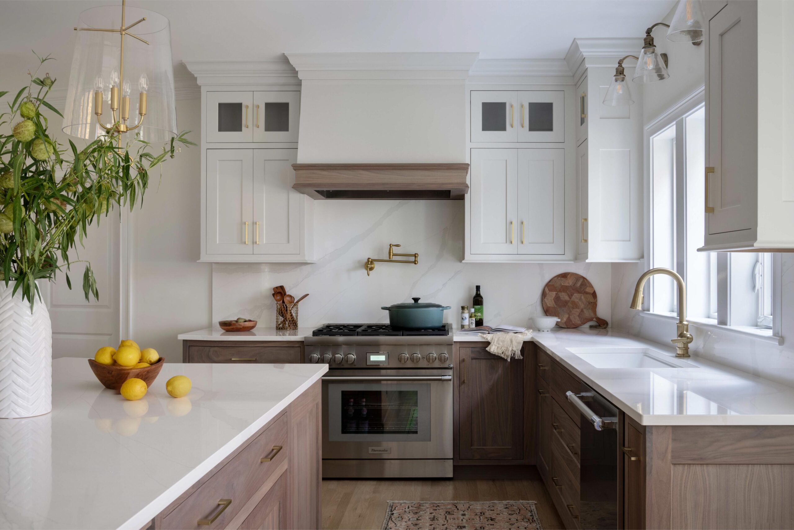 Thoughtfully curated cooking zone with full height backsplash and pot filler