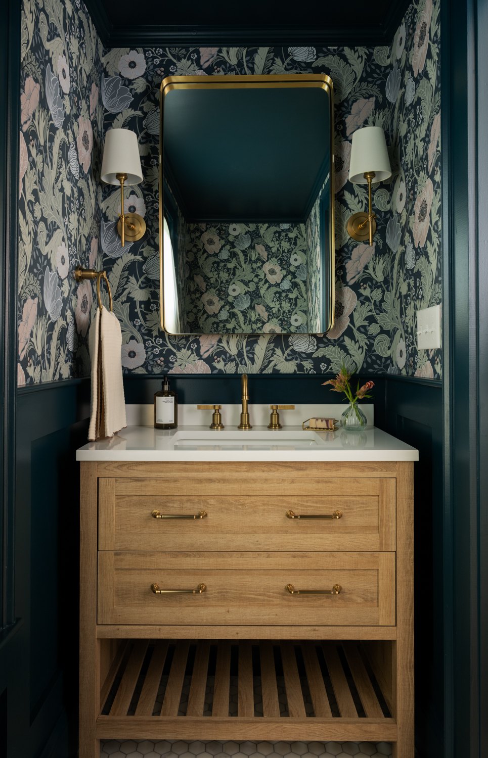 Powder room vanity with paired sconces and a slim mirror
