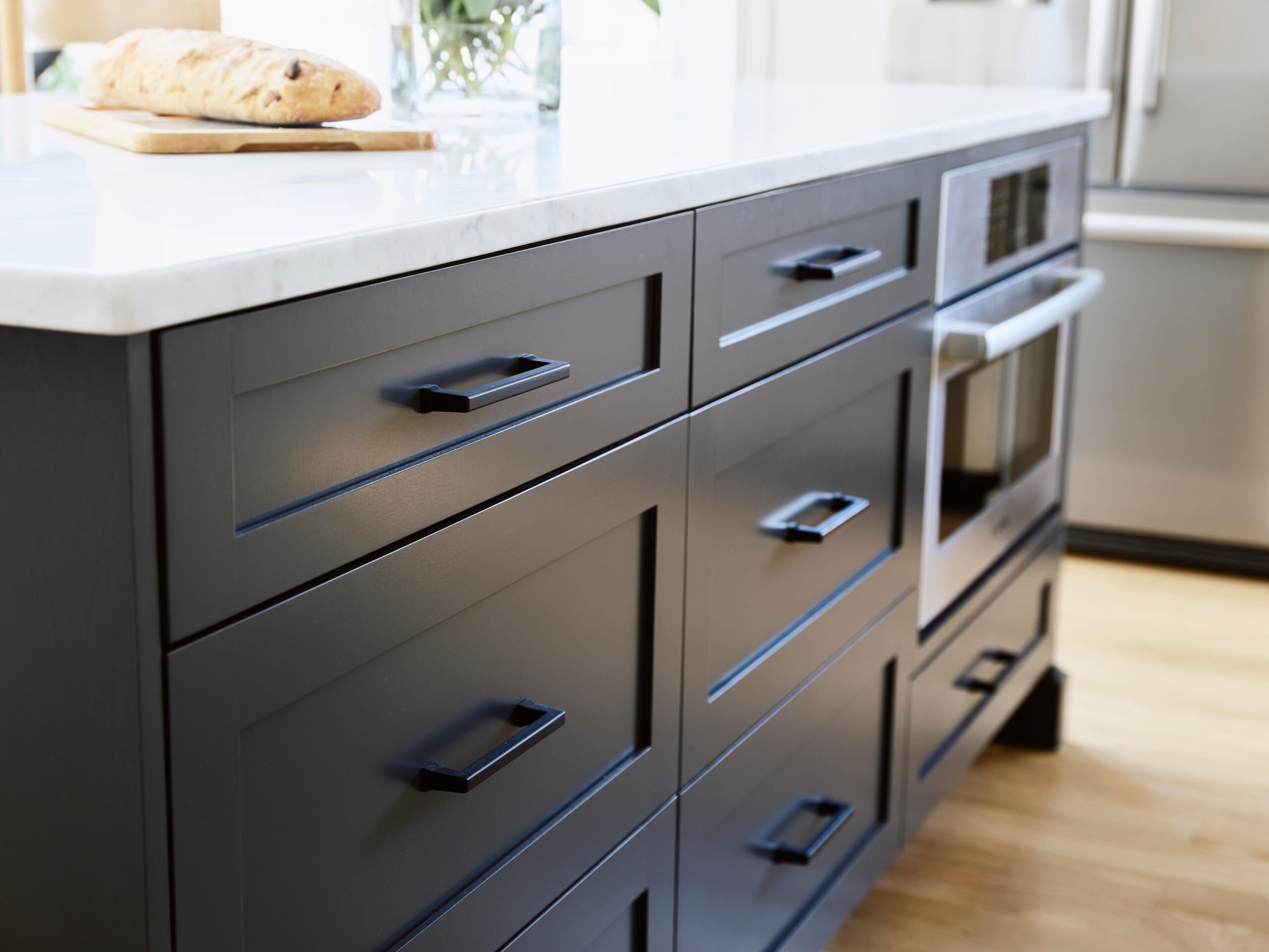 Black painted cabinets with black cabinet handles.